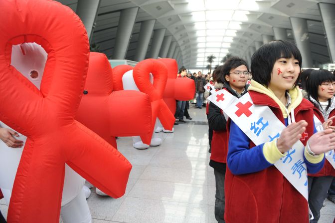 Volunteers from Red Cross China take part in an AIDS-awareness event on World AIDS Day in Beijing on December 1, 2009.