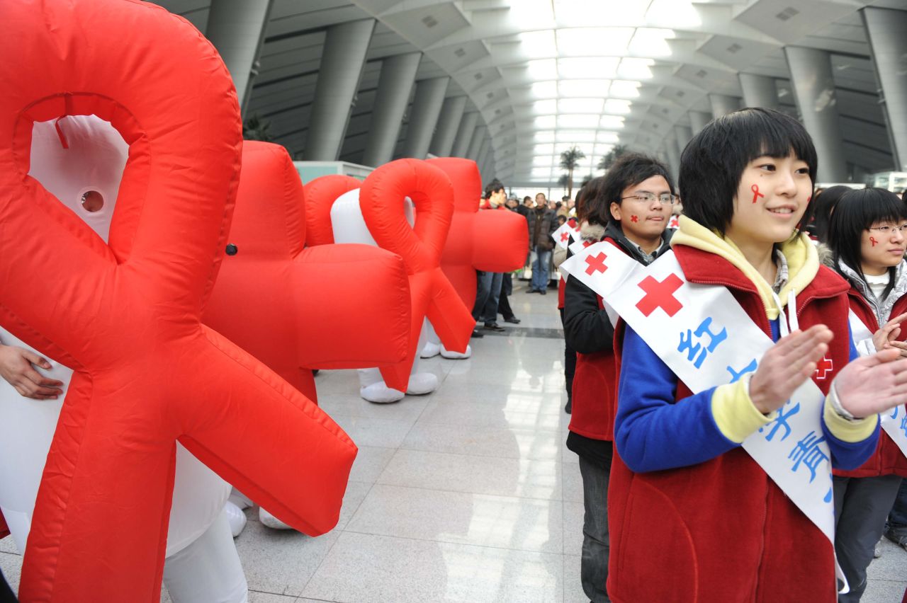 Volunteers from Red Cross China take part in an AIDS-awareness event on World AIDS Day in Beijing, December 1, 2009. 