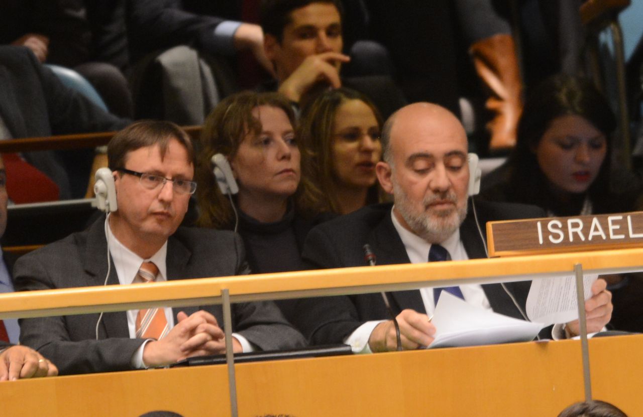 Ron Prosor, right, Israeli ambassador to the United Nations, listens to the speech by Mahmoud Abbas.