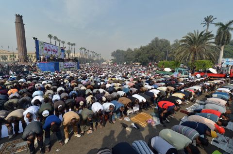 Thousands pray during a rally in support of Morsy in front of Cairo University on December 1.