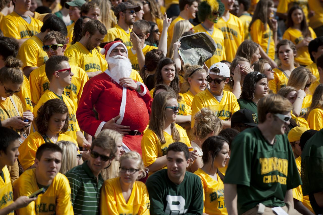 A fan of the Baylor University Bears dresses up as Santa Claus while the Bears face the Oklahoma State University Cowboys on Saturday, December 1, in Waco, Texas. 