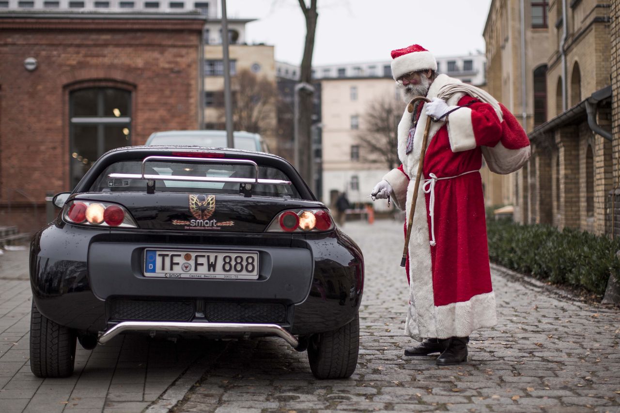 A man dressed as Santa leaves the the annual meeting of volunteer Santa Clauses and angels on December 1 in Berlin. Studentenwerk Berlin, a student organization at the German capital's technical university, hosts a general meeting for guidelines on participating in this year's events during the festive season.