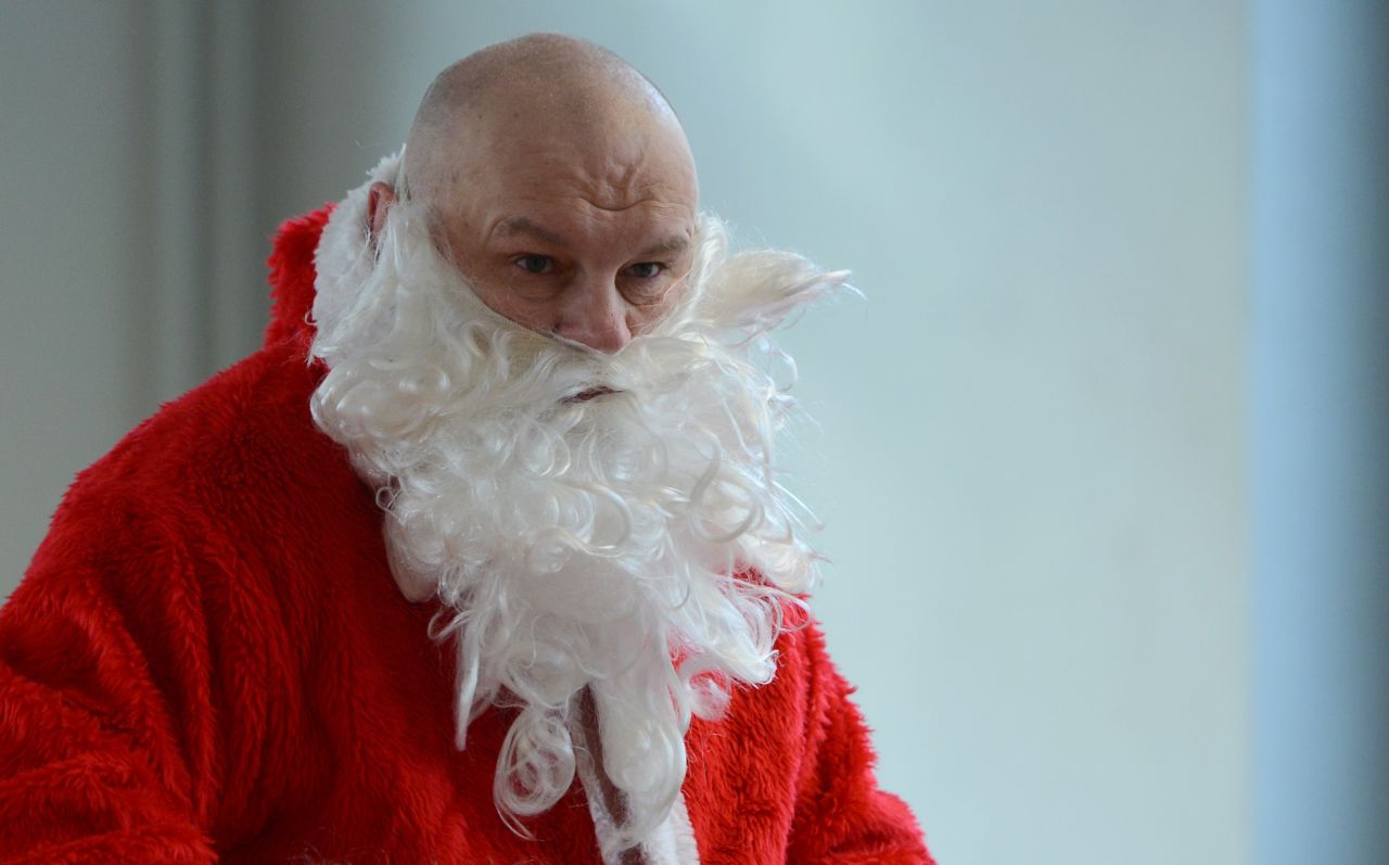 A man dressed as Santa Claus attends Berlin's meeting of volunteer Santa Clauses and angels on December 1 in Berlin. 