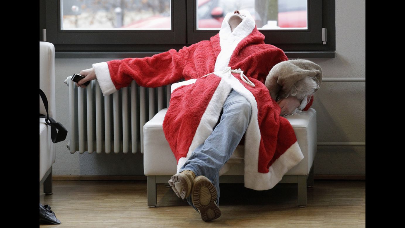 A volunteer Santa Claus takes a nap during the general meeting outlining guidelines for Father Christmases in Berlin on December 1.