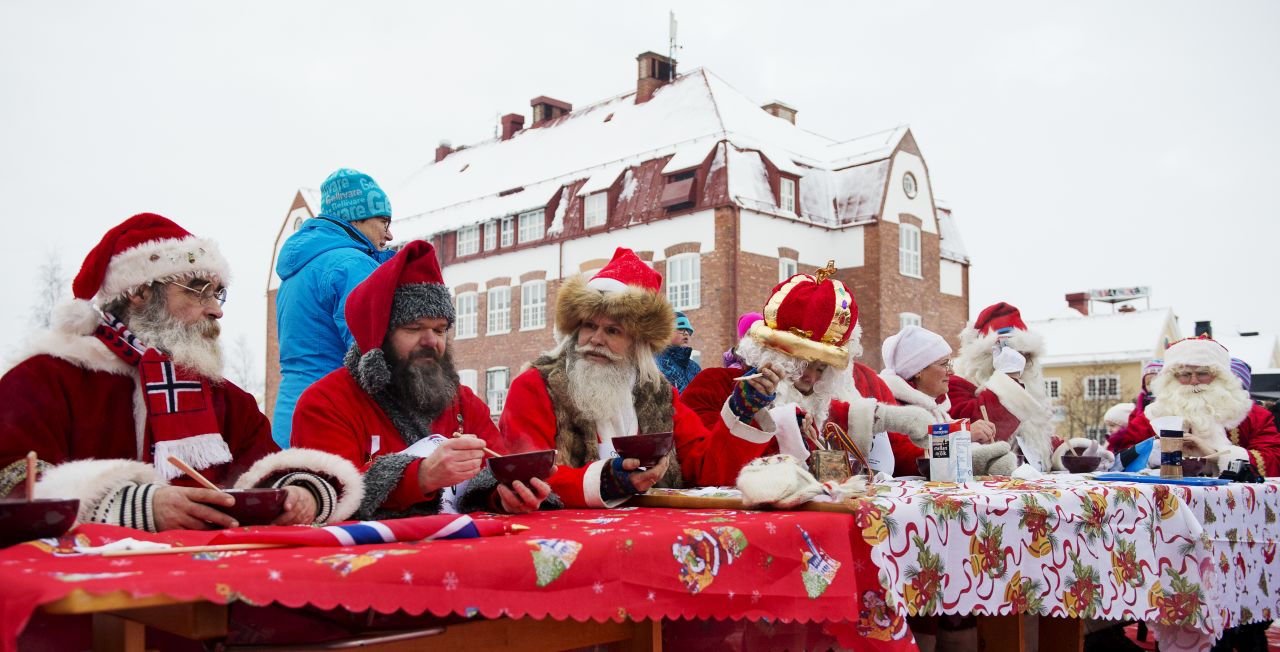 Santas from various countries compete in the porridge-eating contest during the Santa Claus Winter Games in Gallivare on November 17. 