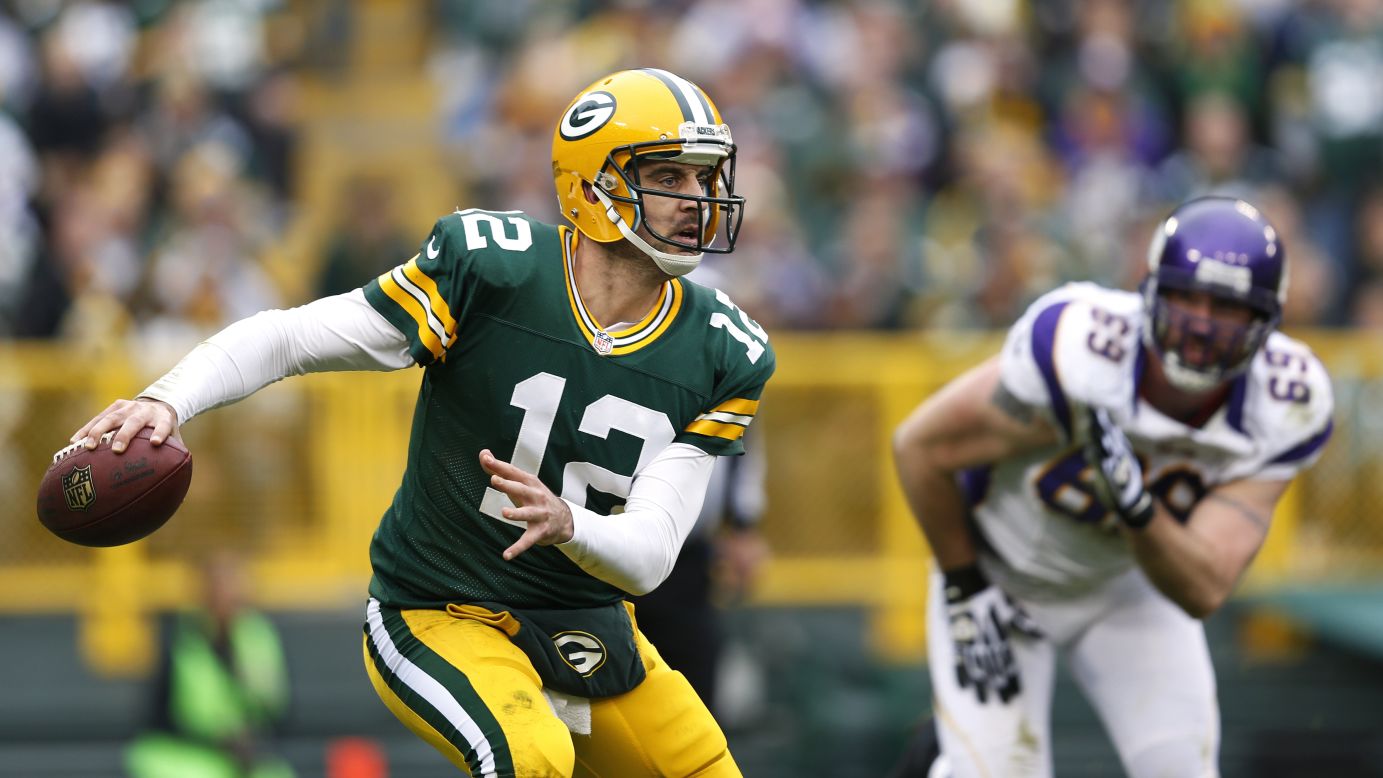 Aaron Rodgers of the Green Bay Packers looks to pass the ball while under pressure from Jared Allen of the Minnesota Vikings on Sunday.