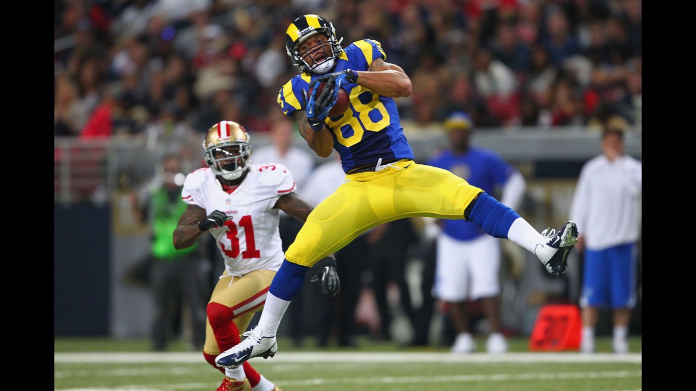 Lance Kendricks of the St. Louis Rams catches a pass against Donte Whitner of the San Francisco 49ers on Sunday at the Edward Jones Dome in St. Louis.
