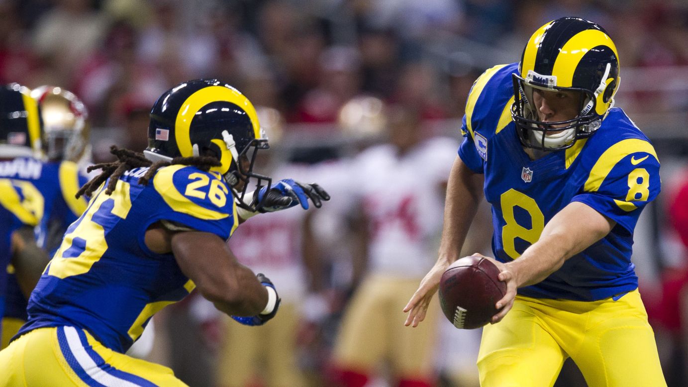 Quarterback Sam Bradford of the St. Louis Rams hands off the ball on Sunday.