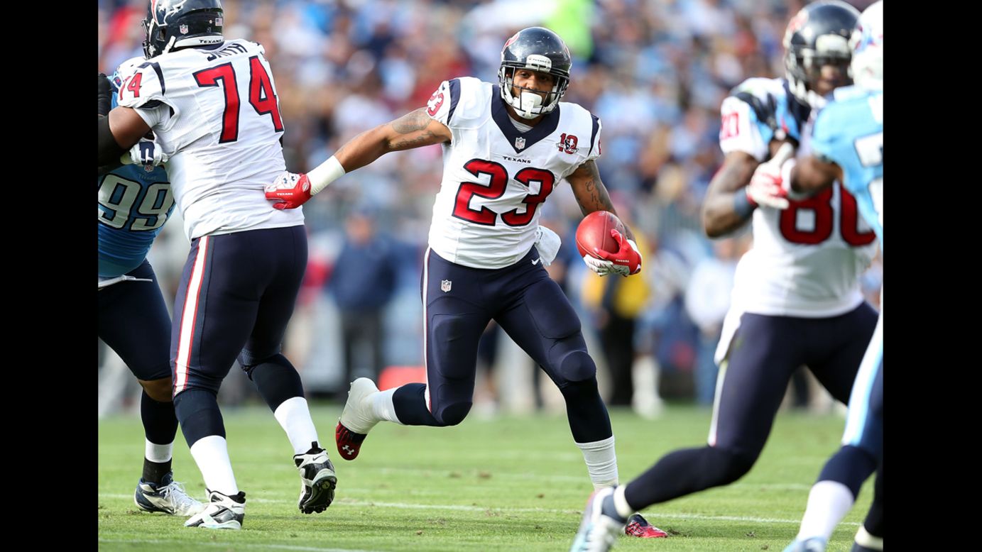 Arian Foster of the Houston Texans runs with the ball on Sunday.