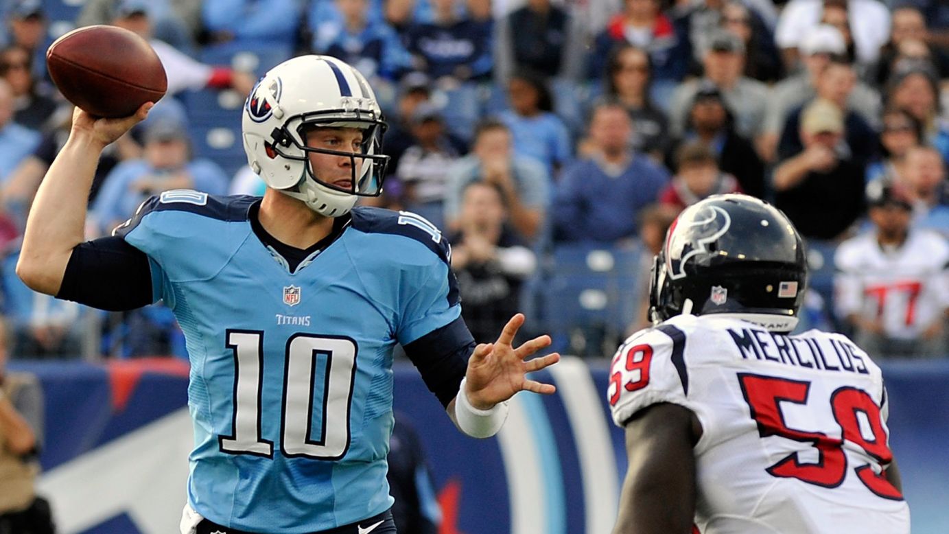 Quarterback Jake Locker of the Tennessee Titans drops back to pass over Whitney Mercilus of the Houston Texans on Sunday.