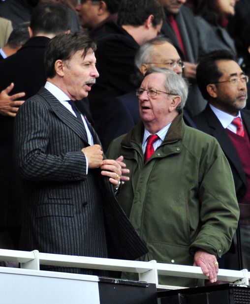 Arsenal long-serving chairman Peter Hill-Wood, seen here to the right of the club's  majority shareholder Stan Kroenke, suffered a heart attack the day before the Swansea game.