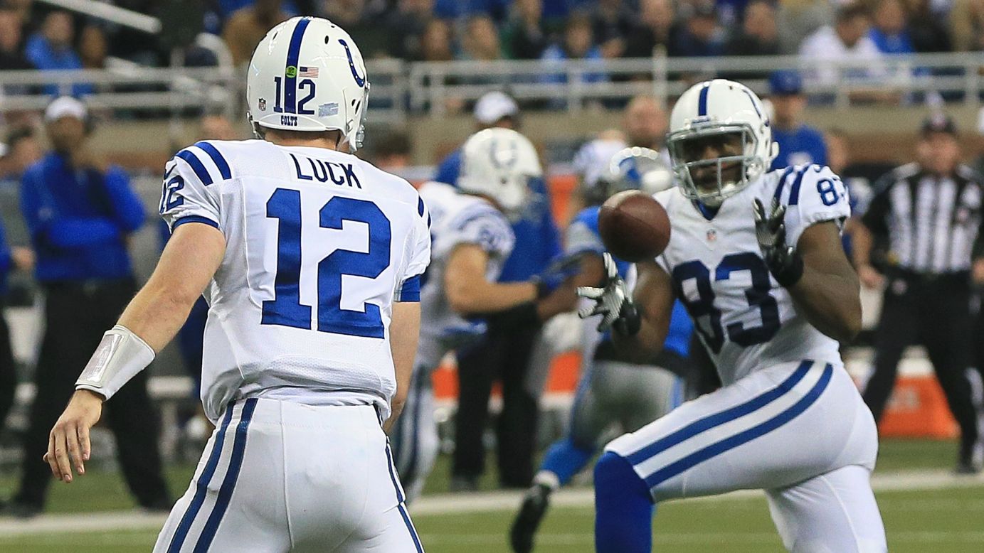 Andrew Luck of the Indianapolis Colts completes a short pass to teammate Dwayne Allen against the Detroit Lions on Sunday.