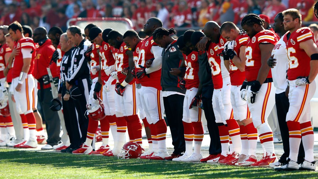 Before their game against the Carolina Pathers, the Kansas City Chiefs pause for a moment of silence.