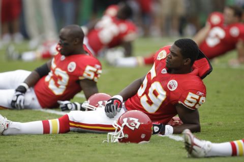 Belcher stretches before the game against the Oakland Raiders at Arrowhead Stadium on September 20, 2009, in Kansas City.