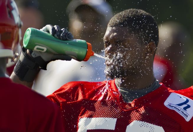 Belcher cools off from temperatures over 100 degrees during a training camp practice on the campus of Missouri Western State University in St. Joseph, Missouri, on August 1, 2011.