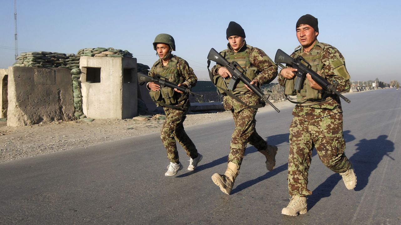 Afghan National Army soldiers arrive in Jalalabad after suicide attackers detonated bombs outside a U.S. base in Afghanistan.
