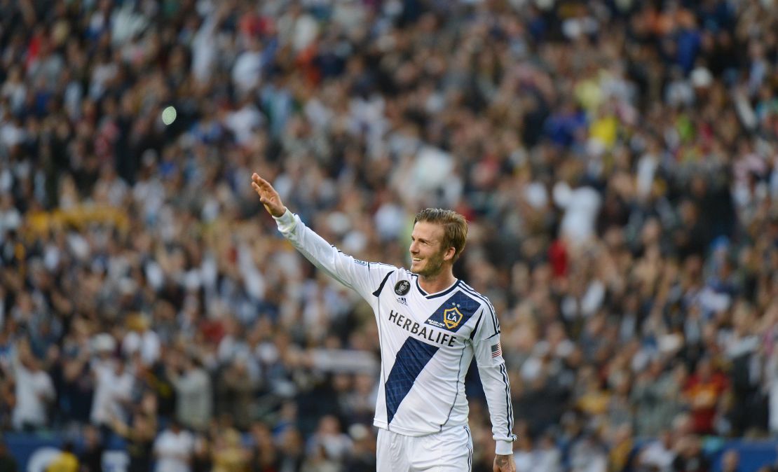 David Beckham waves to fans as he walks off the pitch after the Los Angeles Galaxy defeat the Huston Dynamo in the 2012 MLS Cup. 