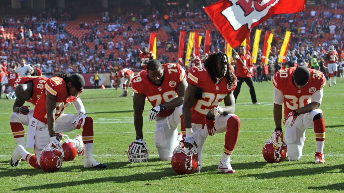 The Kansas City Chiefs kneel and pray before a game against the Carolina Panthers on Sunday, December 2, 2012 at Arrowhead Stadium in Kansas City, Missouri.