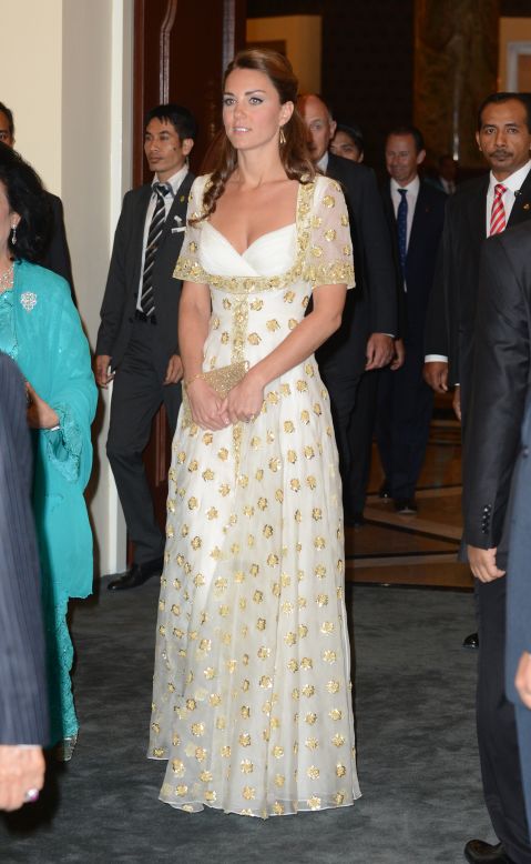 The duchess donned a white and gold gown by Alexander McQueen for a dinner hosted by Malaysia's head of state on September 13.