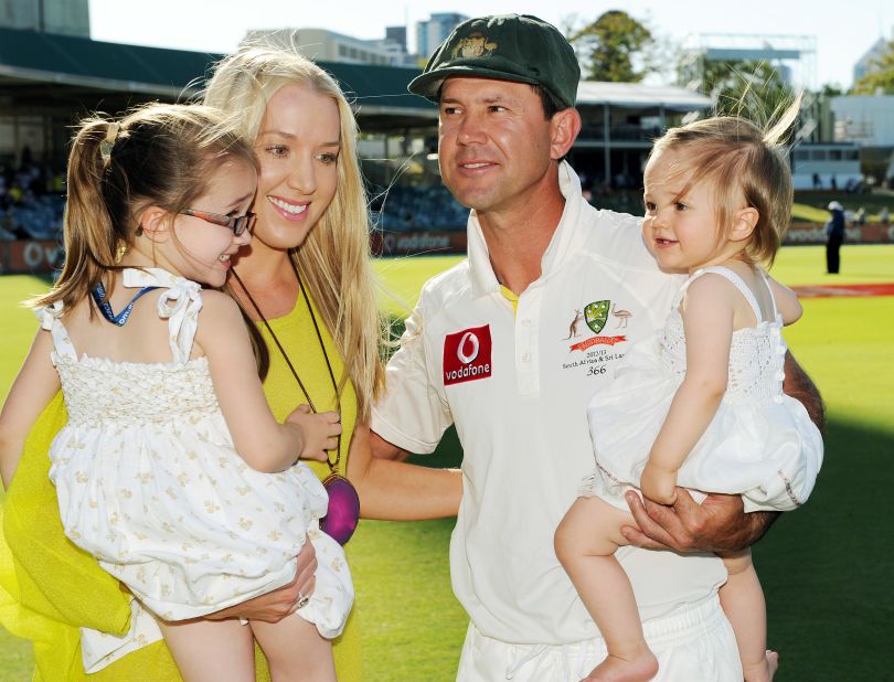 Ponting holds daughter Matisse (R), as his wife Riannna carries daughter Emmy (L), following Australia's defeat in the third and final Test of the series against South Africa at the WACA ground in Perth.