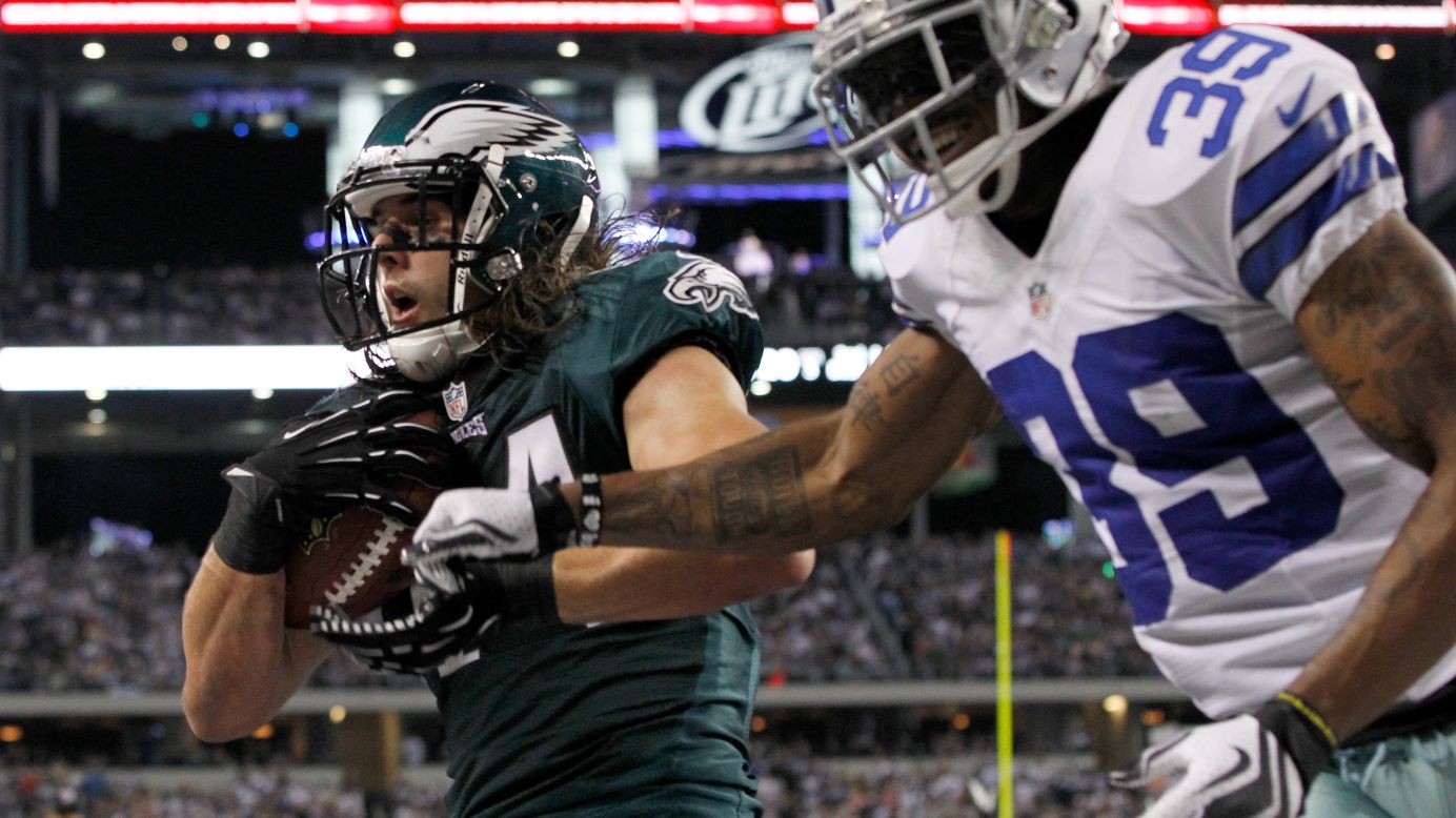 Riley Cooper of the Philadelphia Eagles pulls in a touchdown pass against Brandon Carr of the Dallas Cowboys on Sunday.