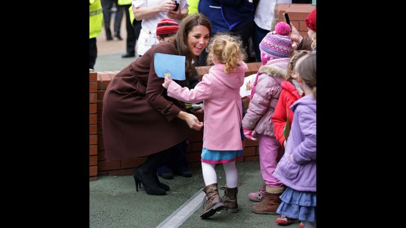 Catherine greets a young girl during a walkabout as she visits Alder Hey Children's Hospital on February 14, 2012, in Liverpool, England. 