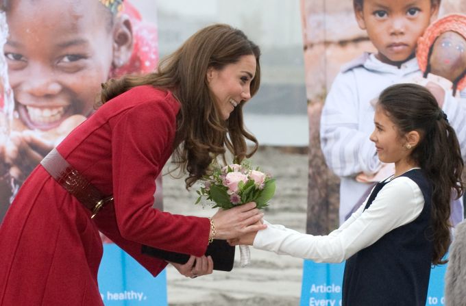 Catherine receives a bouquet of flowers from a young girl during her visit to the UNICEF Centre on November 2, 2011, in Copenhagen, Denmark.