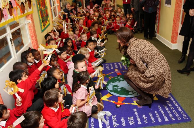 Catherine, right, speaks with schoolchildren during an official visit to the Art Room facilities at Rose Hill Primary School in Oxford on February 21, 2012.