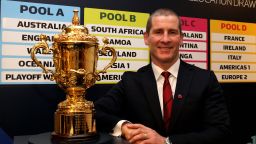 England rugby coach Stuart Lancaster with the Webb Ellis trophy after the draw for the 2015 World Cup, which his country will host. England will be in the toughest group along with Wales and Australia.