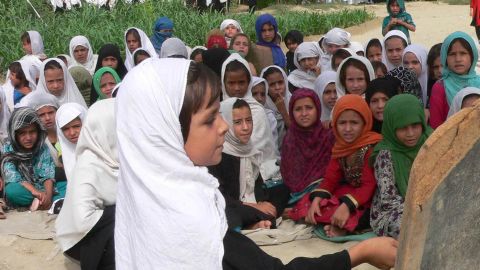 Afghan schoolgirls study in an open air school in Jalalabad. Violence against women is a major problem in Afghanistan.