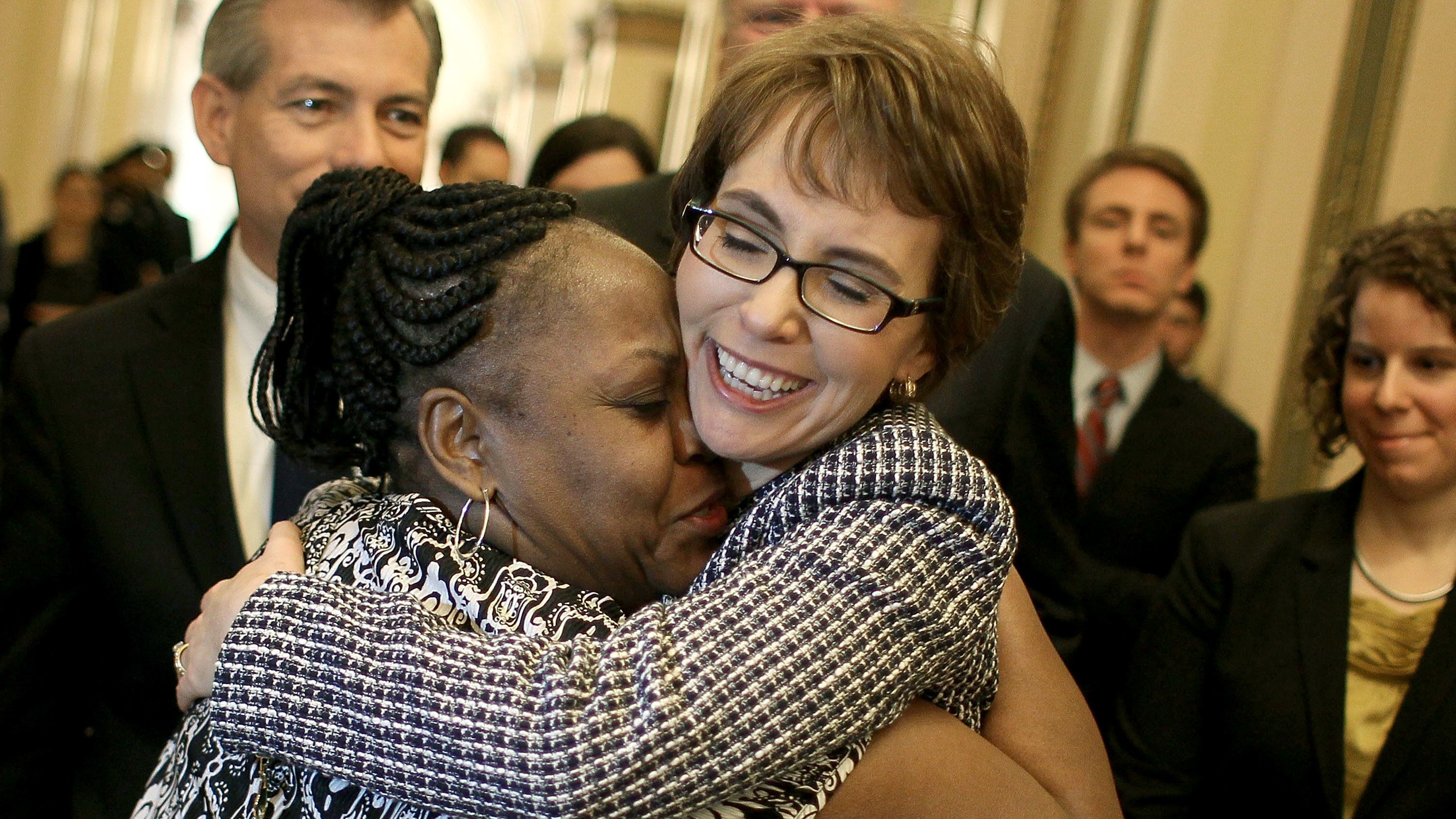 Former U.S. Rep. Gabrielle Giffords hugs House Cloak Room attendant Ella Terry after resigning from Congress in January 2012