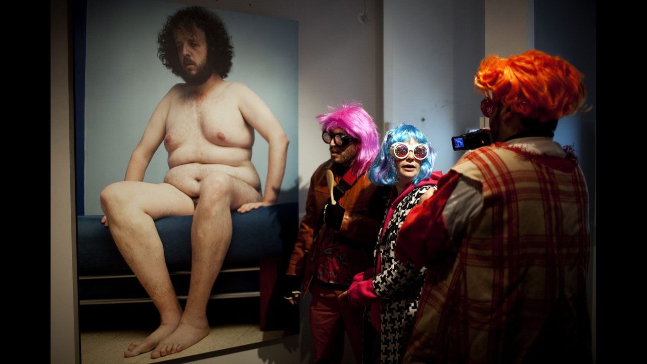 <strong>February 20: </strong>Israeli students wearing costumes visit an art exhibition in downtown Jerusalem. The special cultural project aimed to draw people out in spite of the cold weather to enjoy art in a party atmosphere.