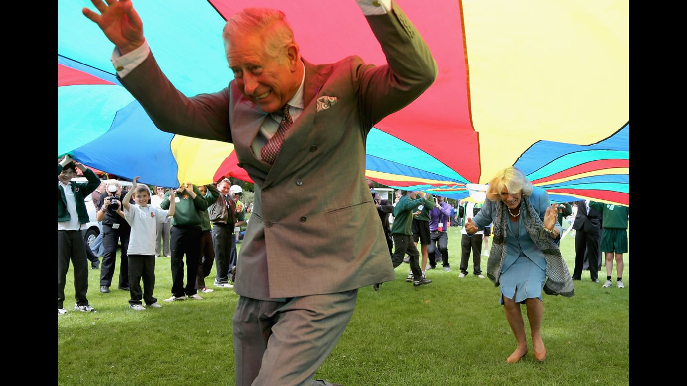 <strong>July 19:</strong> Prince Charles, Prince of Wales, and Camilla, Duchess of Cornwall, take part in a parachute game during a visit to Saumarez Park in St Peter Port, United Kingdom. They were taking part in a Diamond Jubilee visit to the Channel Islands.