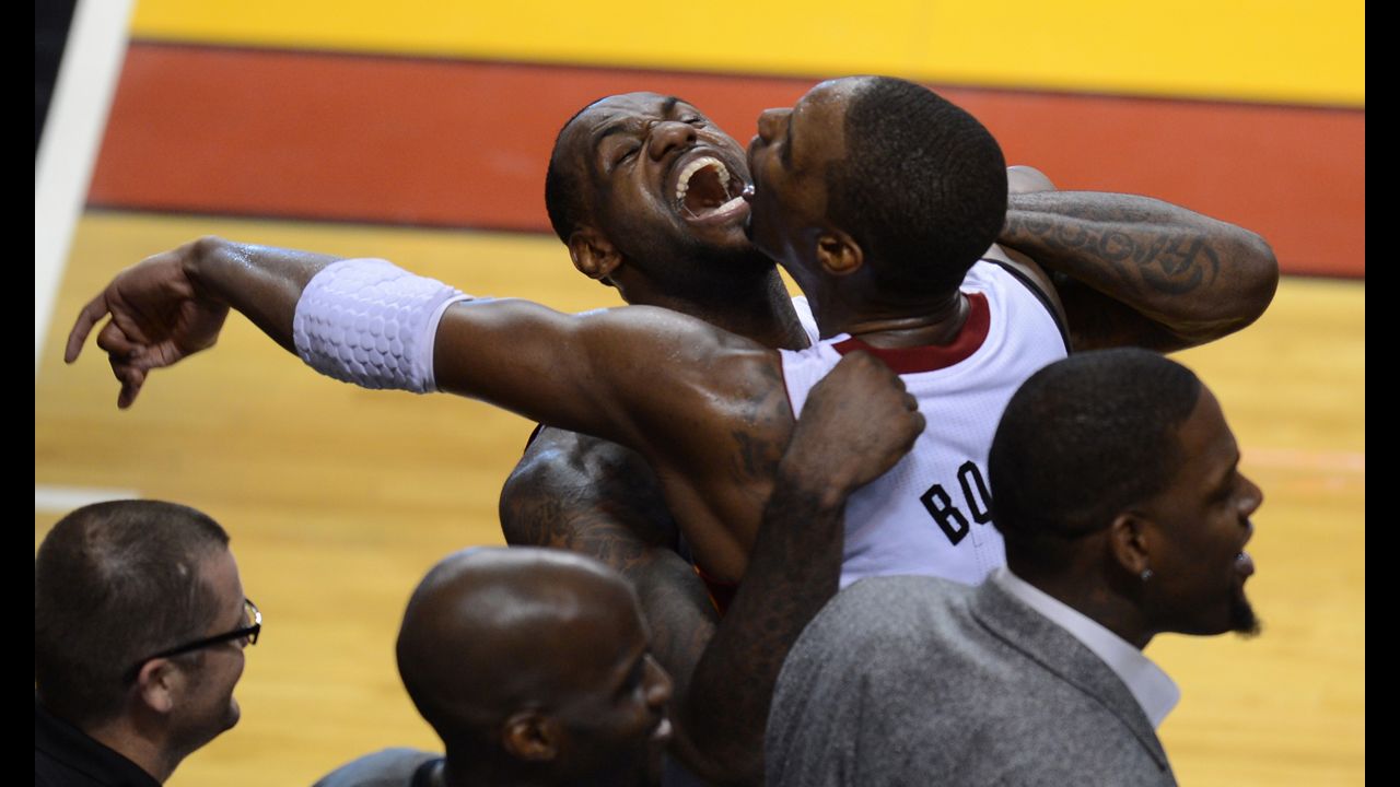 <strong>June 21: </strong>LeBron James of the Miami Heat celebrates with teammate Chris Bosh during the NBA Finals game between the Miami Heat and the Oklahoma City Thunder in Miami. The Heat won the series 4-1.
