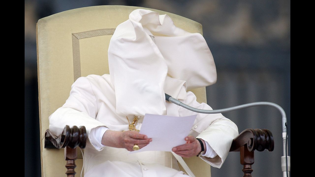 <strong>September 26: </strong>A gust of wind blows Pope Benedict XVI's cloak into his face in St. Peter's Square in Vatican City. Days later, the pope's former butler, Paolo Gabriele, was convicted of aggravated theft for leaking confidential papal documents. He was sentenced to 18 months in prison.