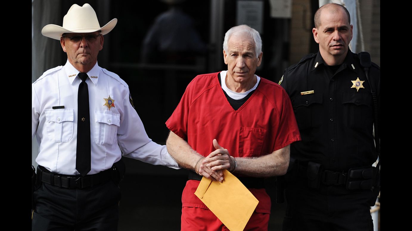 <strong>October 9: </strong>Former Penn State assistant football coach Jerry Sandusky leaves the courthouse in Bellefonte, Pennsylvania, after being sentenced to at least 30 years in prison. Sandusky, 68, was convicted in June on 45 counts of child sexual abuse.