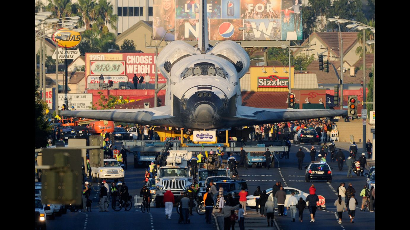 <strong>October 12: </strong>Space Shuttle Endeavour is transported to The Forum arena for a stopover and celebration in Inglewood, California. The space shuttle was on 12-mile journey from the Los Angeles International Airport to the California Science Center to go on permanent public display. 