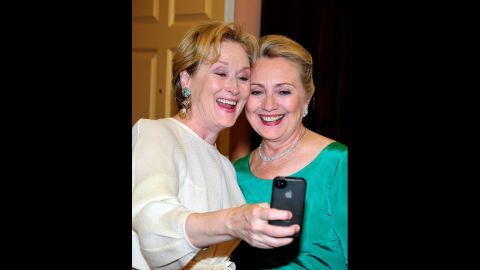 Meryl Streep snaps a picture with U.S. Secretary of State Hillary Clinton after a dinner for Kennedy Center honorees that Clinton hosted at the State Department in Washington on Saturday, December 1.  The 2012 honorees include blues musician Buddy Guy, actor Dustin Hoffman, late-night talk-show host David Letterman, dancer Natalia Makarova, and the surviving members of British rock band Led Zeppelin -- Robert Plant, Jimmy Page and John Paul Jones. An awards ceremony recognized the artists' lifetime achievements to American culture on Sunday, December 2, at the Kennedy Center. Streep was a recipient last year.