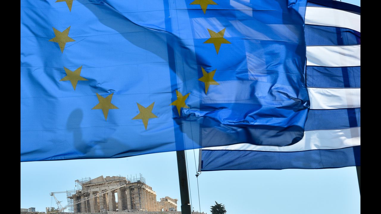 <strong>October 12:</strong> The European Union wins the Nobel Peace Prize while grappling with the worst crisis since its founding -- devastating debt and the threat of disintegration. The flag of the 27-nation union, left, flies alongside the flag of debt-ridden Greece in front of the Acropolis in central Athens.