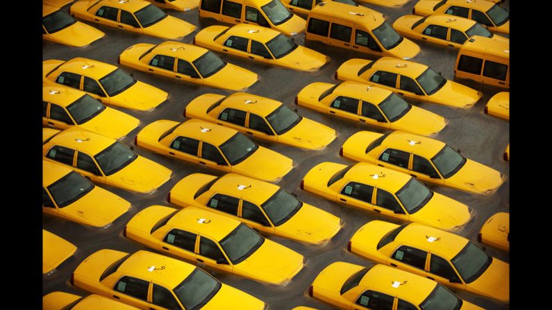 <strong>October 30: </strong>Taxis sit in a flooded lot in Hoboken, New Jersey, after Superstorm Sandy devastated the region. The storm slammed ashore near Atlantic City, New Jersey, after forming in the Caribbean and sweeping northward, killing 182 people from Haiti to Canada.