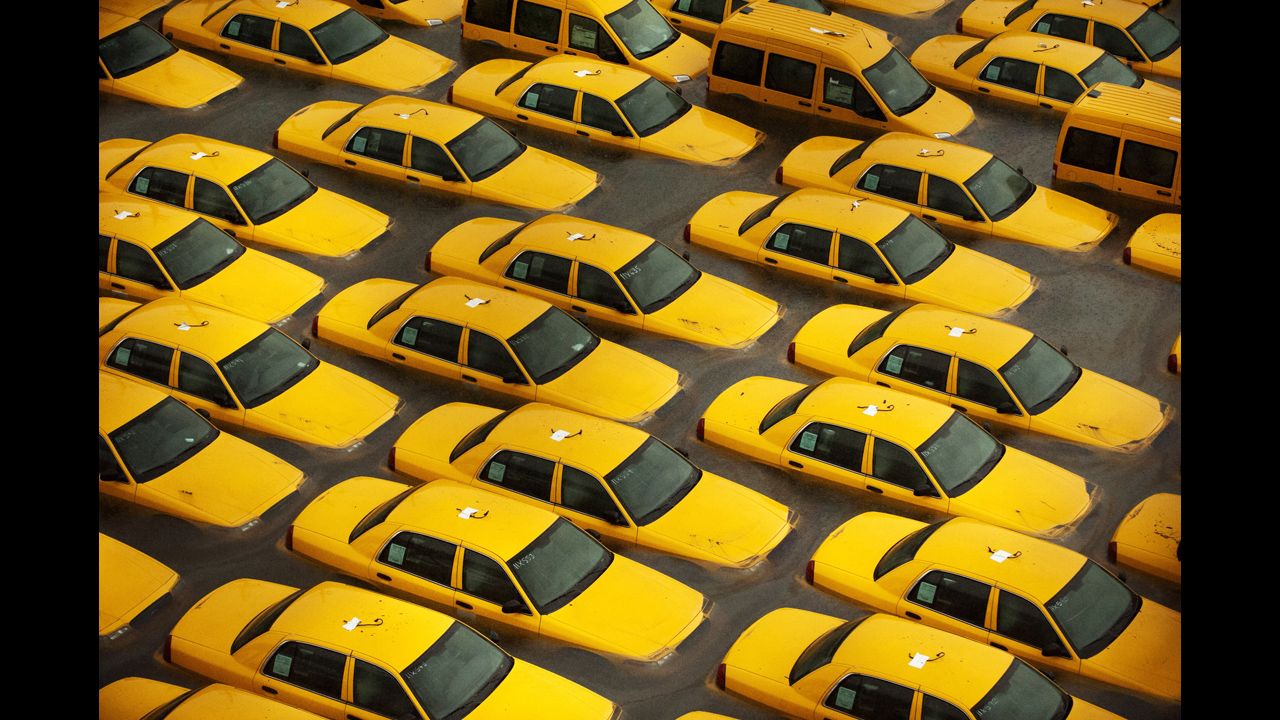 <strong>October 30: </strong>Taxis sit in a flooded lot in Hoboken, New Jersey, after Superstorm Sandy devastated the region. The storm slammed ashore near Atlantic City, New Jersey, after forming in the Caribbean and sweeping northward, killing 182 people from Haiti to Canada.