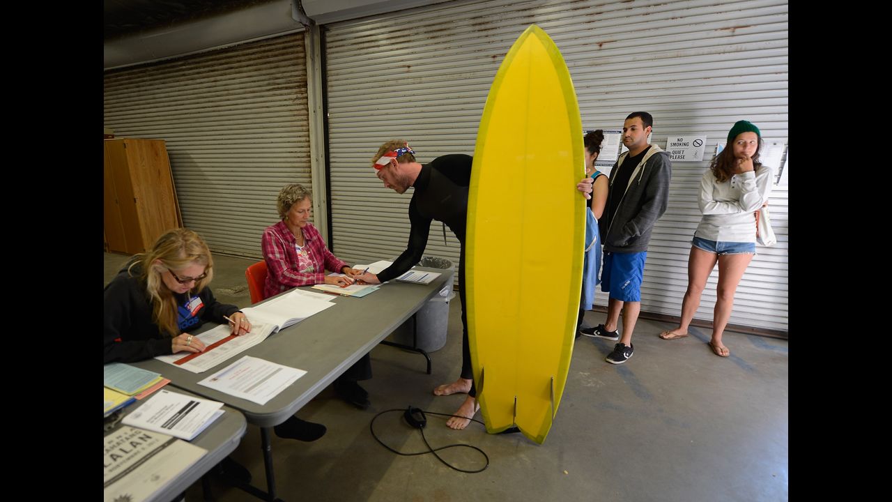 <strong>November 6: </strong>Mike Wigart picks up his ballot at a polling station in the garage of the Los Angeles County lifeguard headquarters. Americans headed to the polls to vote in the race between President Barack Obama and Republican candidate Mitt Romney.