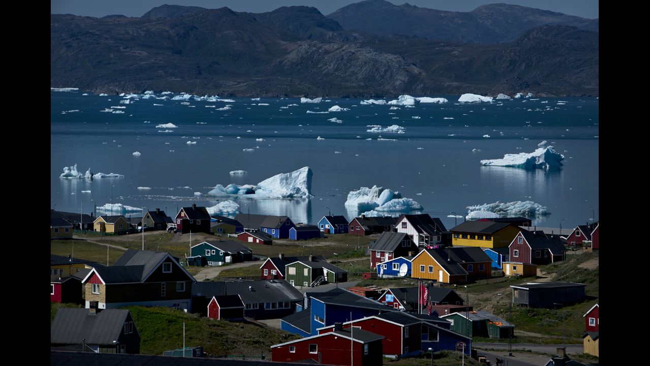 <strong>July 23:</strong> Icebergs from nearby glaciers float in the bay in Narsaq, Greenland.