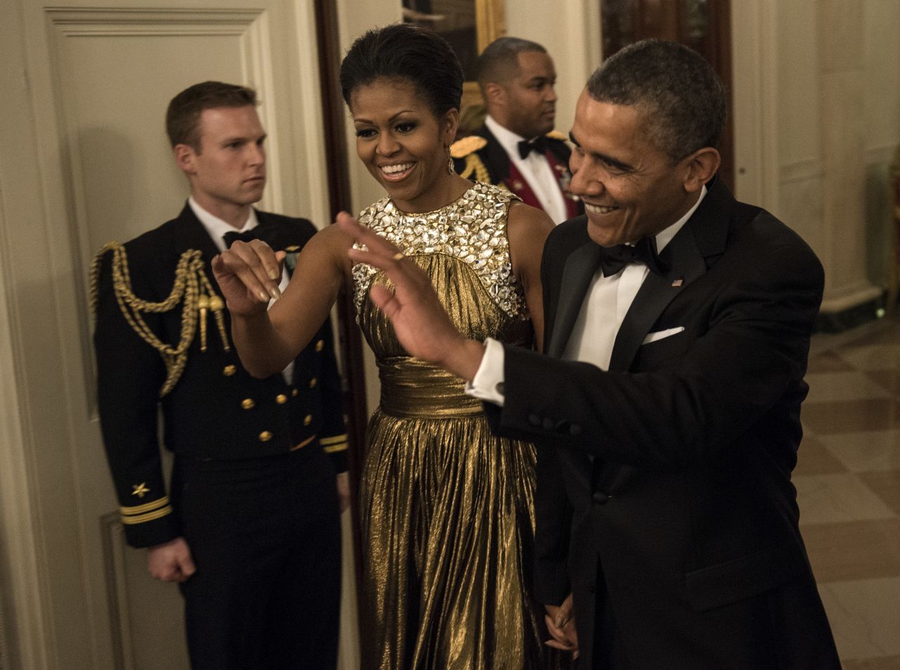 The Obamas arrive for the pre-honors reception Sunday at the East Room of the White House.