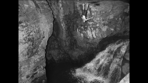 <strong>August 13:</strong> A man dives into the water near Kaaterskill Falls in the Catskill Mountains in the Hudson Valley.