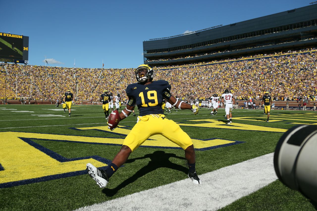 Devin Funchess of the University of Michigan celebrates after scoring a touchdown against the University of Massachusetts Minutemen on September 15 at Michigan Stadium in Ann Arbor, Michigan.