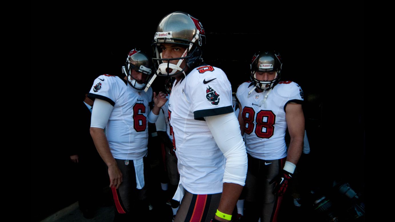 Quarterback Josh Freeman of the Tampa Bay Buccaneers prepares to come out on the field Sunday to warm up before a game against the Denver Broncos at Sports Authority Field at Mile High in Denver.