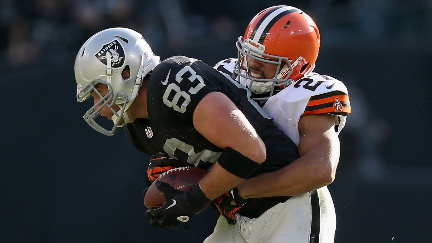 Brandon Myers of the Oakland Raiders is tackled by Eric Hagg of the Cleveland Browns on Sunday.