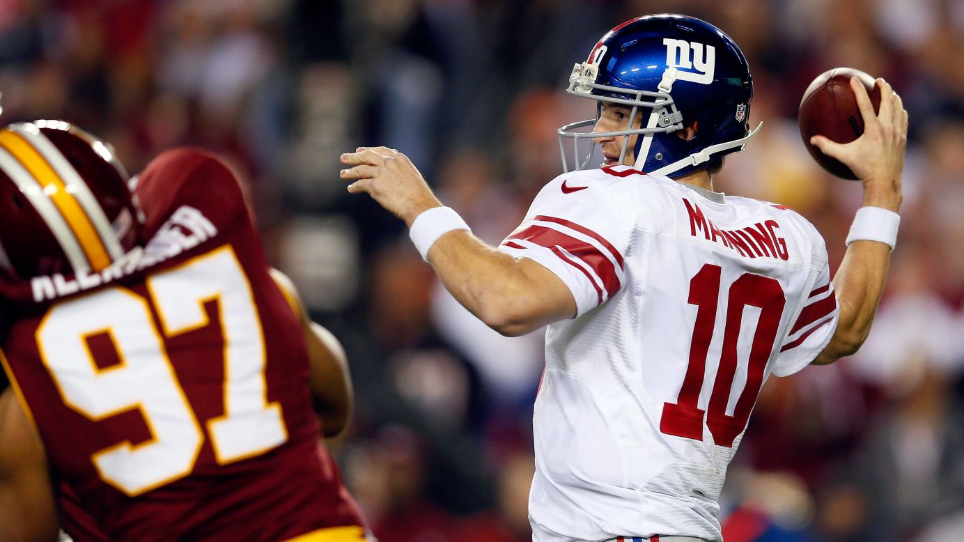 Giants quarterback Eli Manning throws the ball in the first quarter of the game against the Redskins.