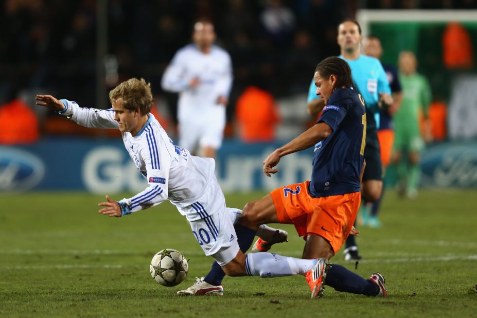 Daniel Congre of Montpellier challenges Teemu Pukki of Schalke during the 1-1 draw in France. The point was enough for the German side to top Group B ahead of Arsenal, which was beaten by Olympiakos.